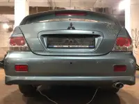 Бампер задній для Mitsubishi Lancer 9