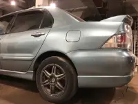 Крило заднє ліве,четвертина кузова для Mitsubishi Lancer 9